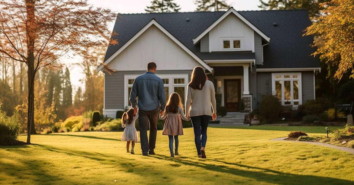 Family walking toward their new home